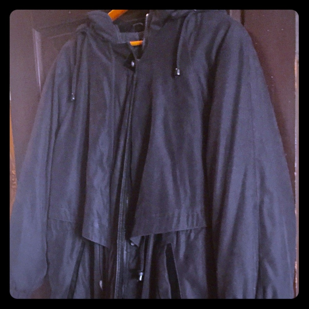 Lined women's black coat with velvet trimmings